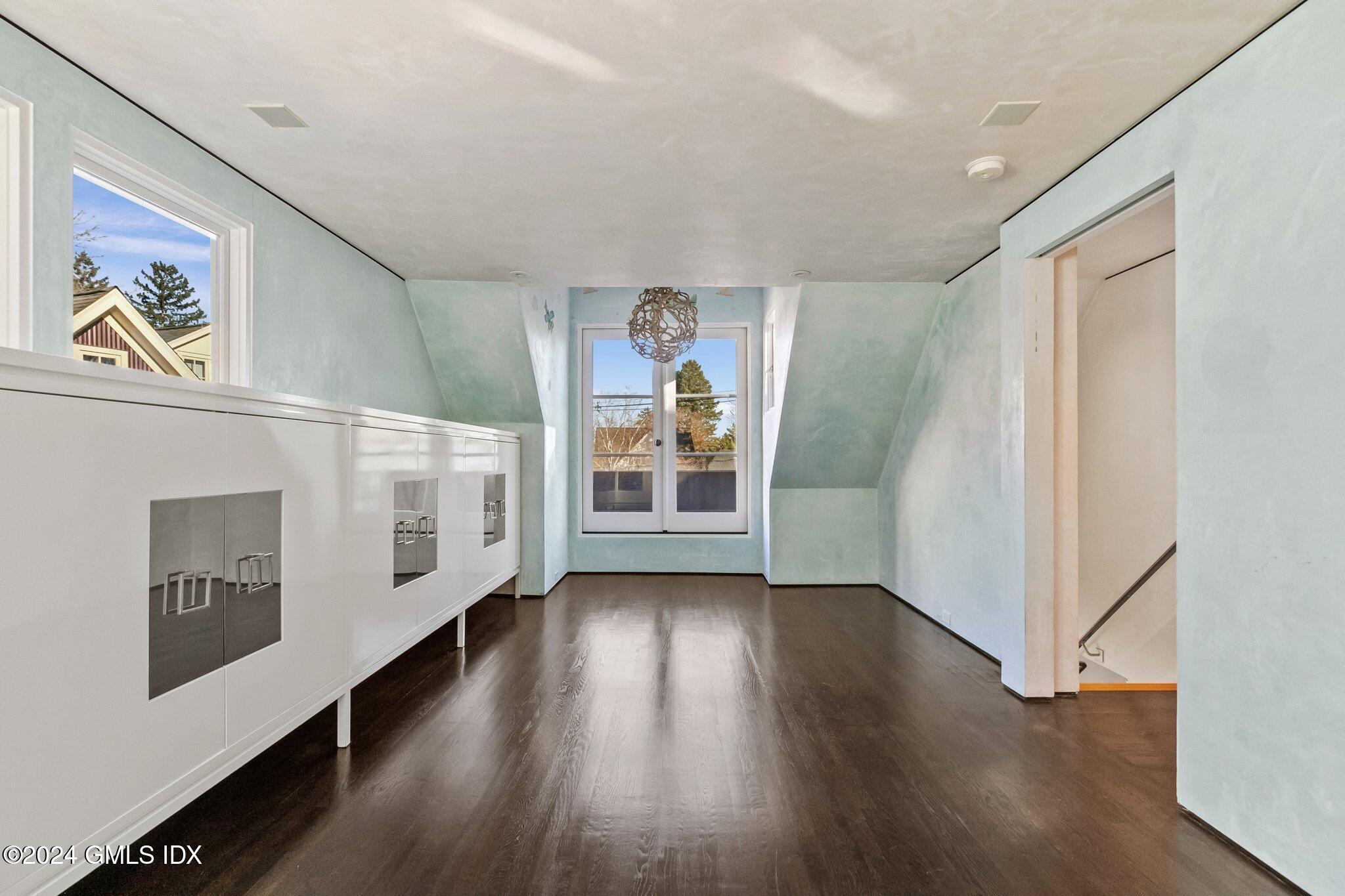 6 Marks Road Riverside, CT 06878 - Photo 11 of 19 a view of a hallway with wooden floor and dining room