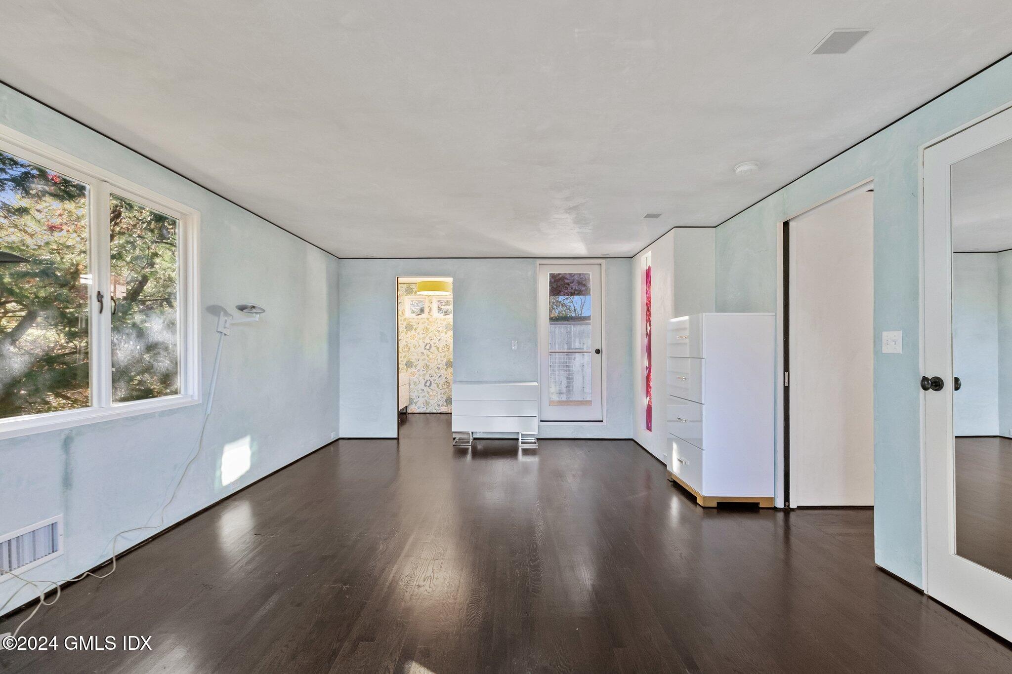 6 Marks Road Riverside, CT 06878 - Photo 9 of 19 a view of an empty room with a window and wooden floor