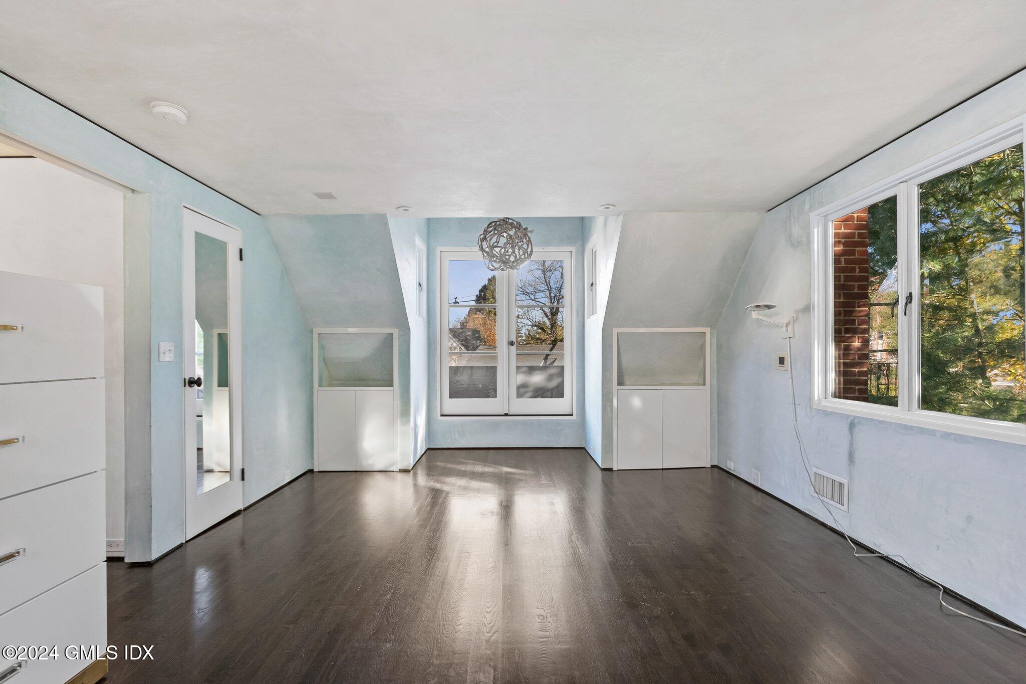 6 Marks Road Riverside, CT 06878 - Photo 10 of 19 an empty room with wooden floor and windows