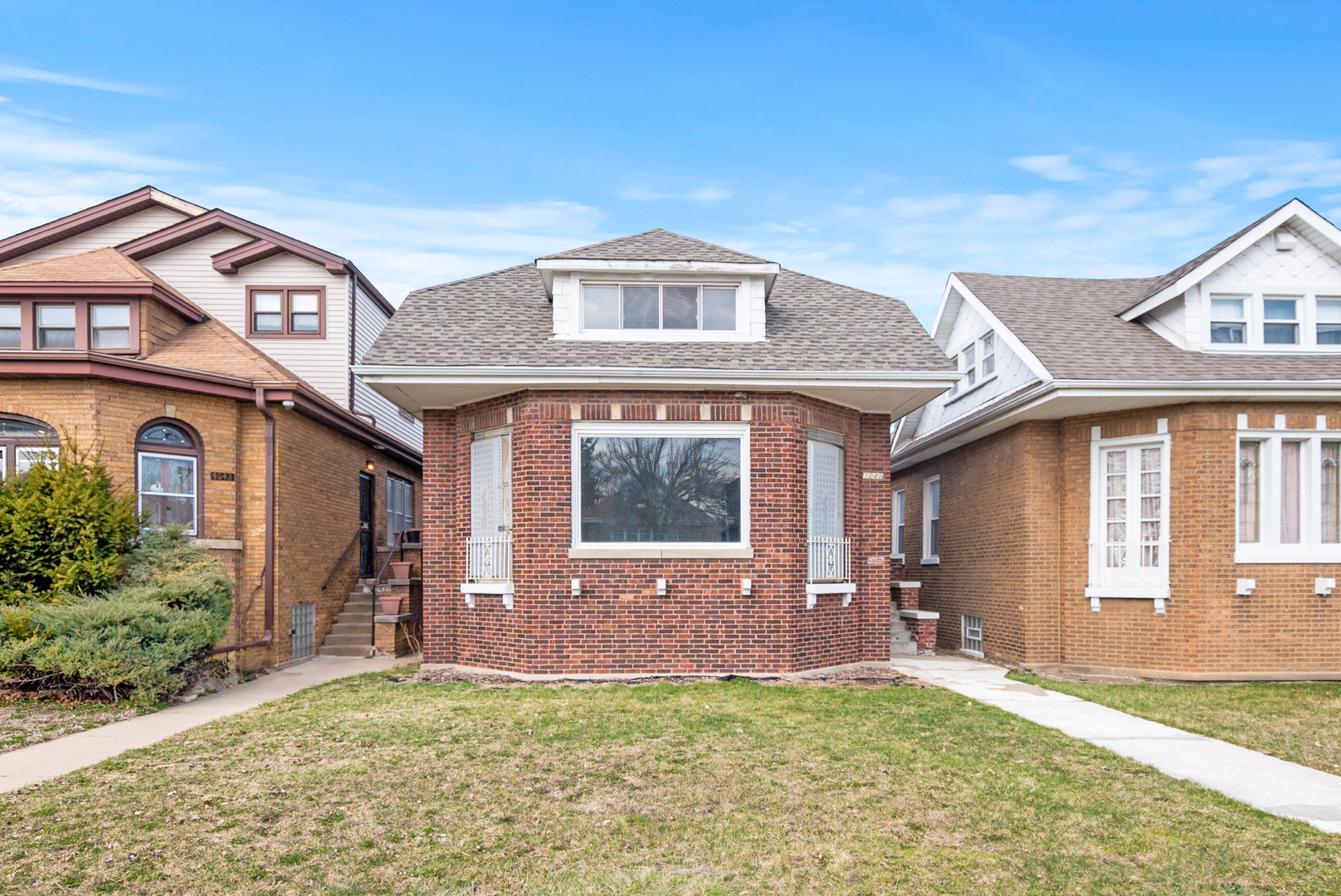 1040 West 92nd Place Chicago, IL 60620 - Photo 19 of 19 a front view of a house with a yard