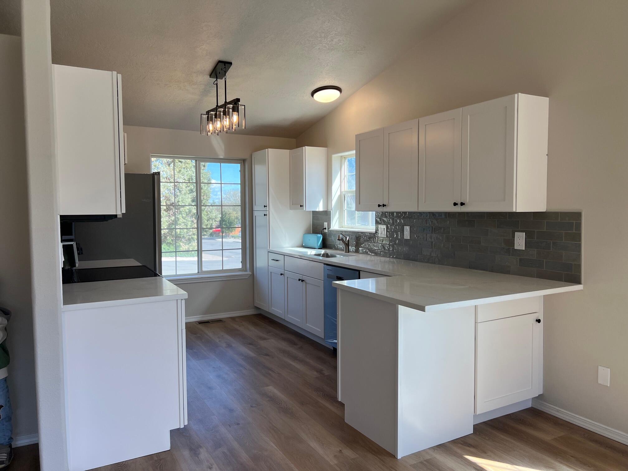 629 Deer Ridge Court Madras, OR 97741 - Photo 10 of 39 a kitchen with a refrigerator sink and cabinets