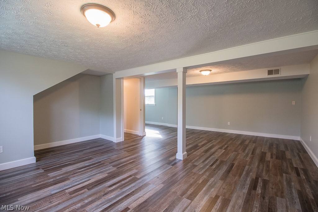 2982 Arcola Road Madison, OH 44057 - Photo 23 of 38 Huge Lower Level Family Room with beautiful luxury vinyl flooring