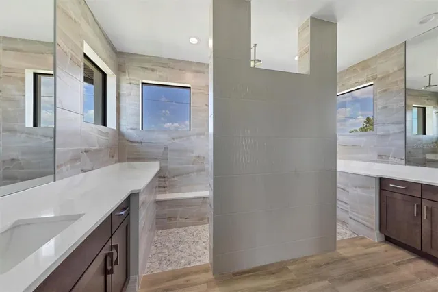 a bathroom with a shower and a sink