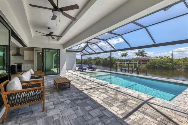 a view of a swimming pool with a patio