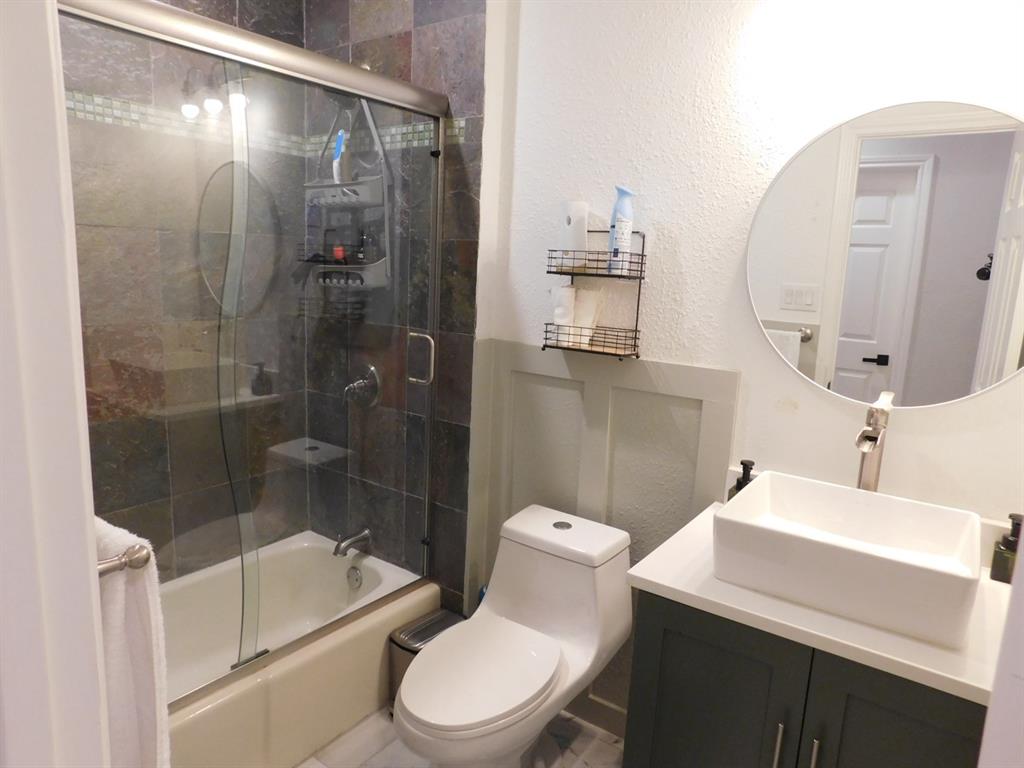 622 Crowley Road Arlington, TX 76012 - Photo 19 of 38 a bathroom with a toilet a sink and shower