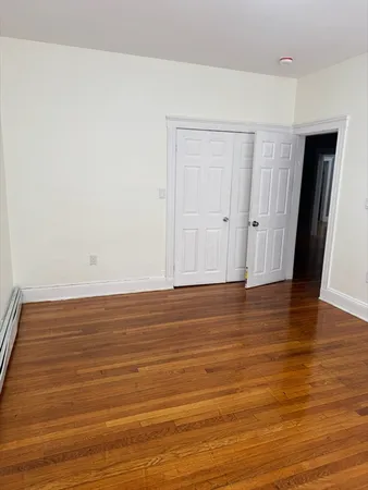 a view of room and wooden floor