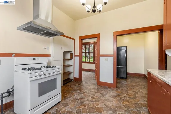 a kitchen with stainless steel appliances granite countertop a stove and a cabinets
