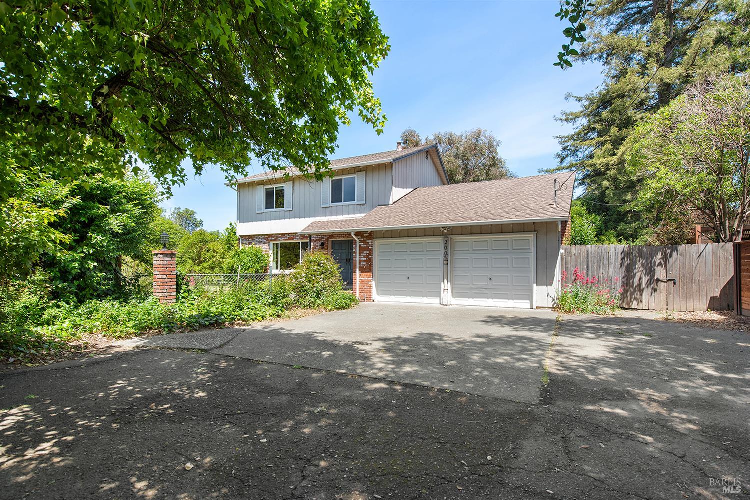 2005 Marsh Road Santa Rosa, CA 95403 - Photo 1 of 1 a front view of a house with a garden