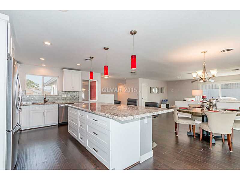 633 East Fairway Road Henderson, NV 89015 - Photo 11 of 35 Property Photo. Kitchen with custom cabinets under center island.