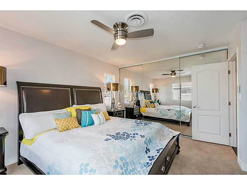633 East Fairway Road Henderson, NV 89015 - Photo 17 of 35 Property Photo. Master bedroom showing mirror closet doors and custom ceiling fan.