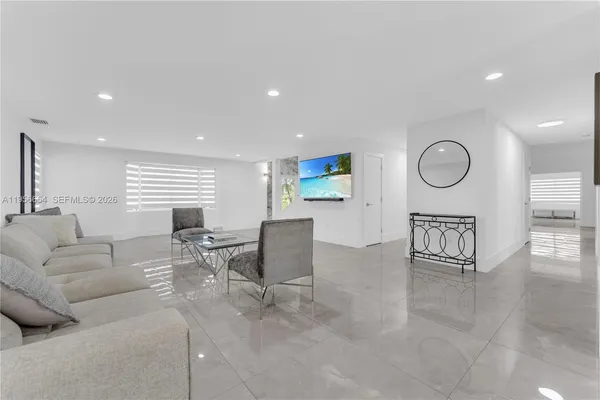 a kitchen with refrigerator and cabinets