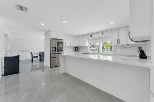 a bedroom with a bed and a fireplace