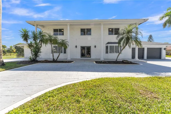 a view of entryway and hall with a dining table