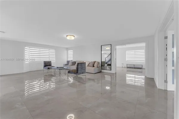 a bathroom with a shower sink vanity mirror and toilet