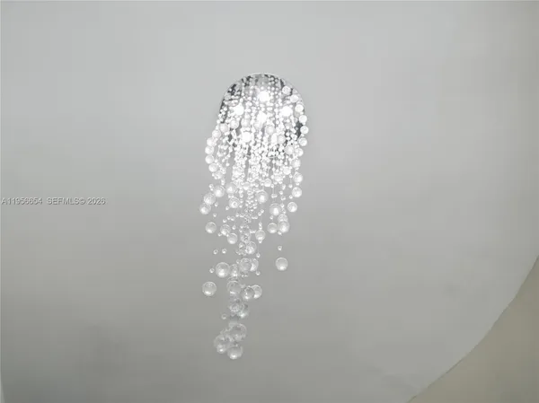 a bathroom with a sink a mirror and a shower