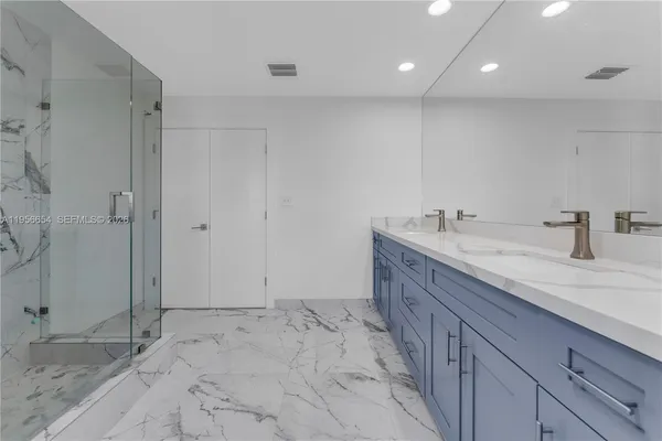 an aerial view of a house with a swimming pool and outdoor space