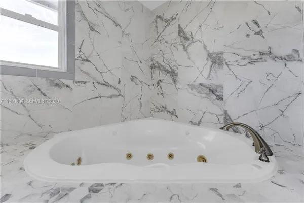 an aerial view of a house with a garden