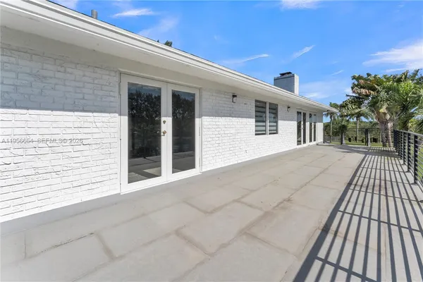 a kitchen with stainless steel appliances granite countertop a sink stove and white cabinets