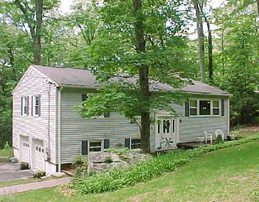 32 Deer Run Road Brookfield, CT 06804 - Photo 1 of 1 a front view of a house with a garden