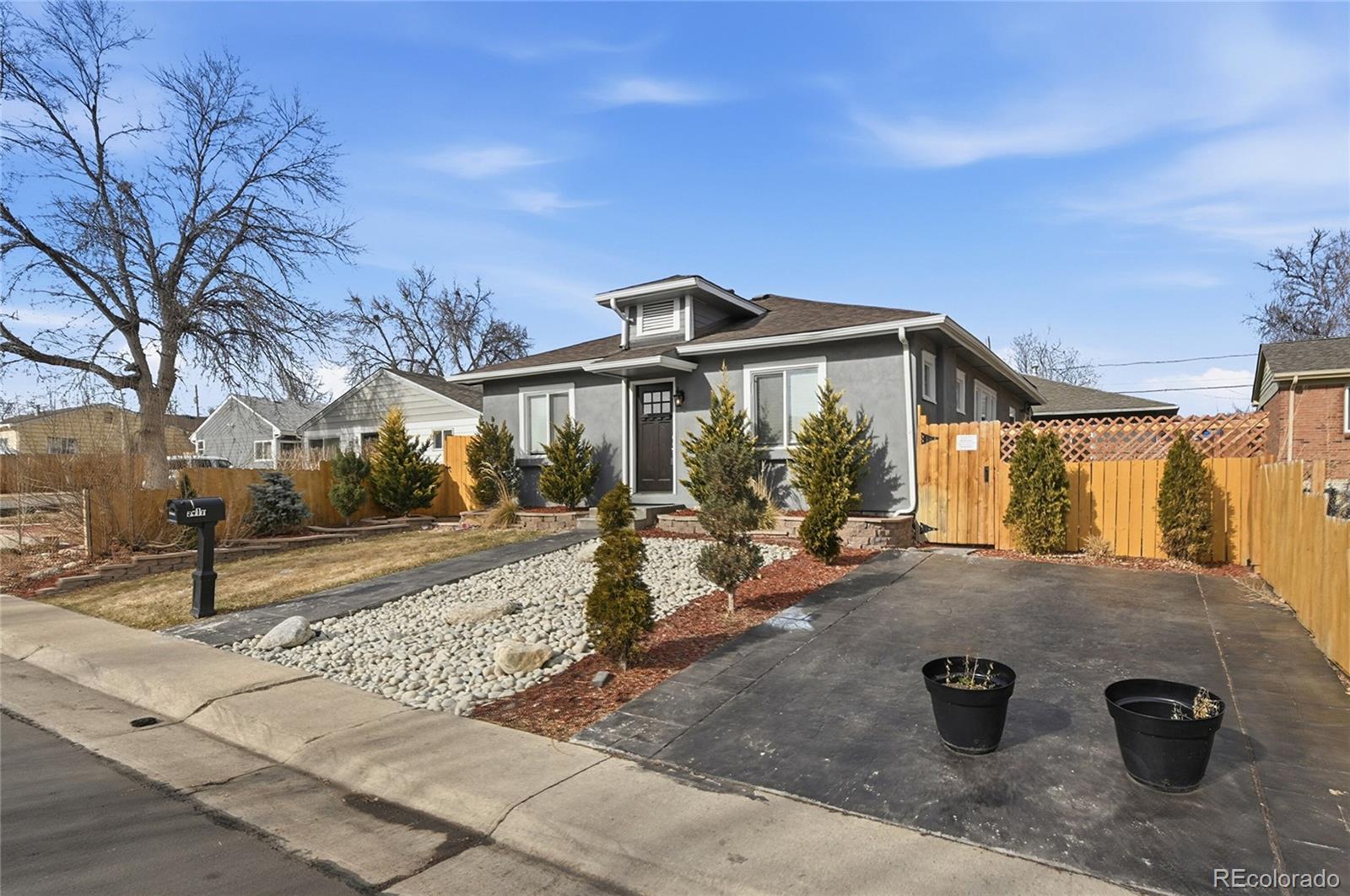 3417 West Alaska Place Denver, CO 80219 - Photo 2 of 30 a view of a house with wooden fence