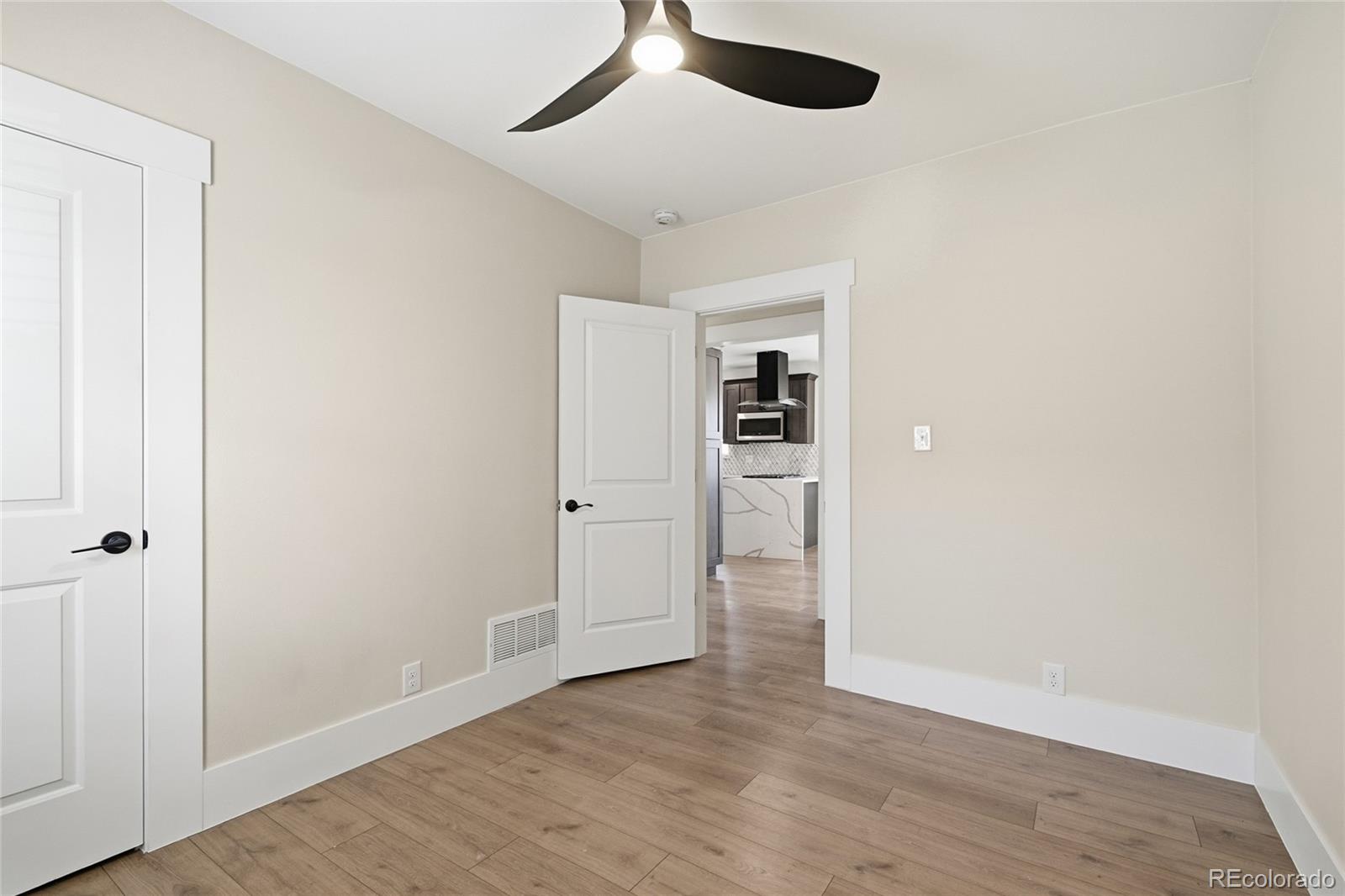 3417 West Alaska Place Denver, CO 80219 - Photo 21 of 30 wooden floor in an empty room