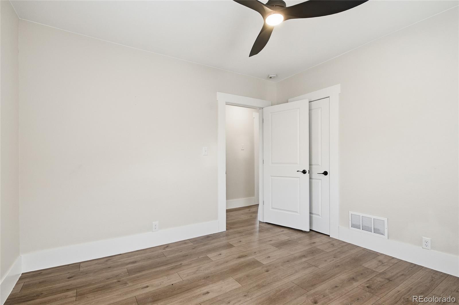 3417 West Alaska Place Denver, CO 80219 - Photo 23 of 30 a view of a room with wooden floor