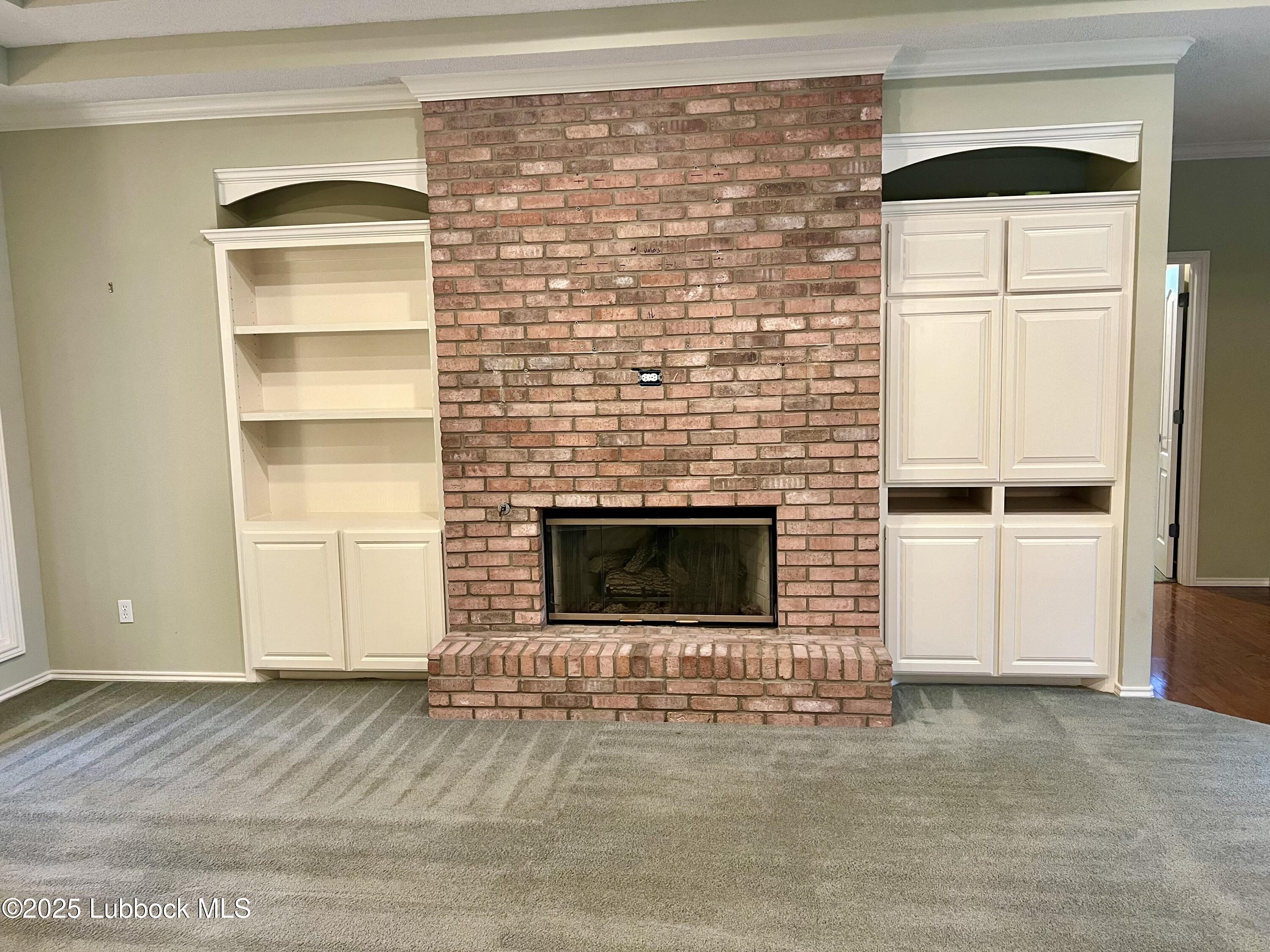 9802 Toledo Avenue Lubbock, TX 79424 - Photo 11 of 64 a view of empty room with a fireplace