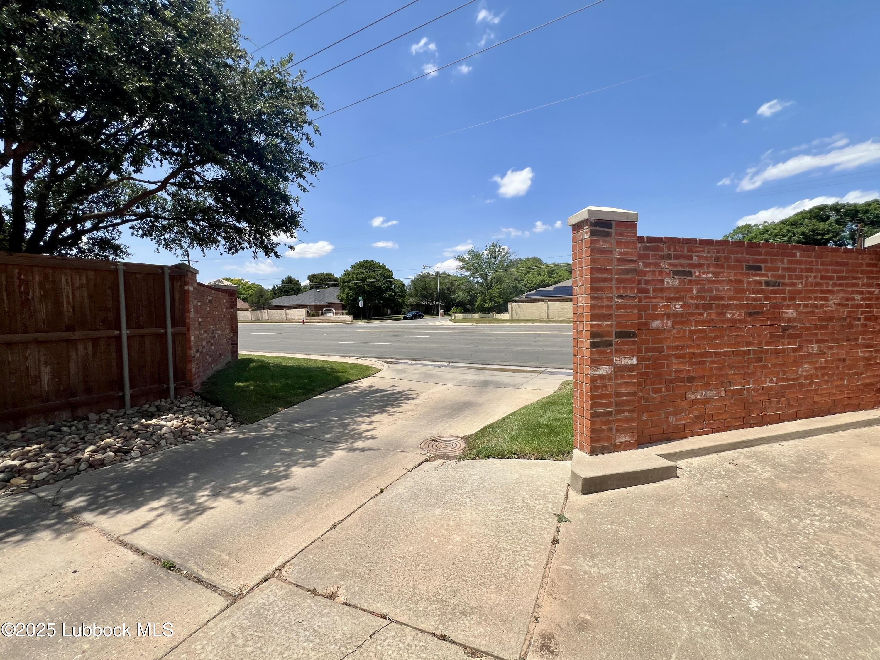 9802 Toledo Avenue Lubbock, TX 79424 - Photo 3 of 64 a view of a house with backyard and tree