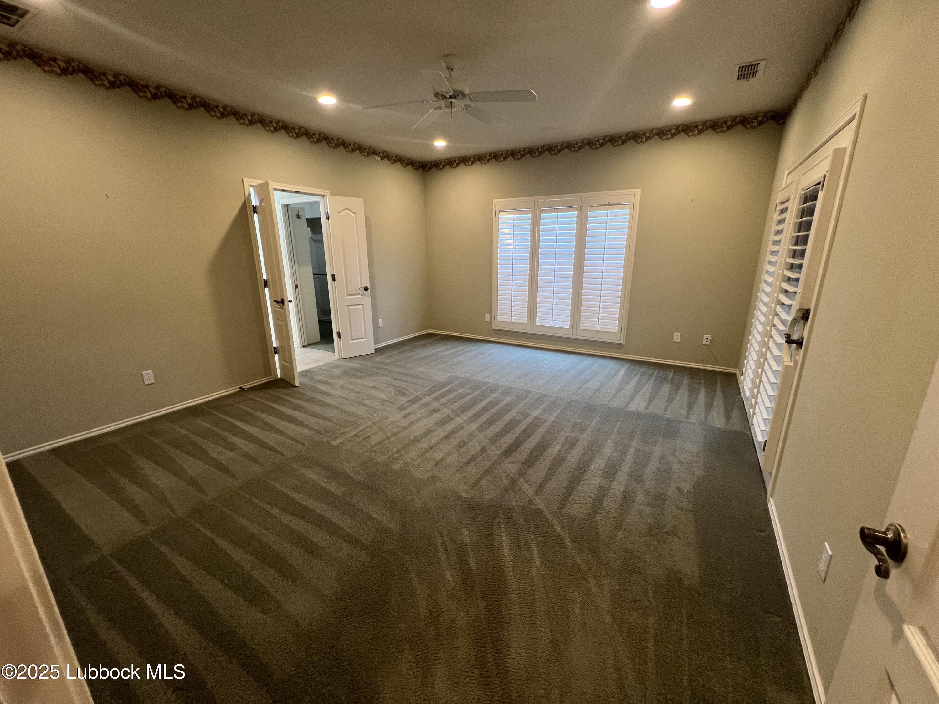 9802 Toledo Avenue Lubbock, TX 79424 - Photo 51 of 64 a view of an empty room with windows