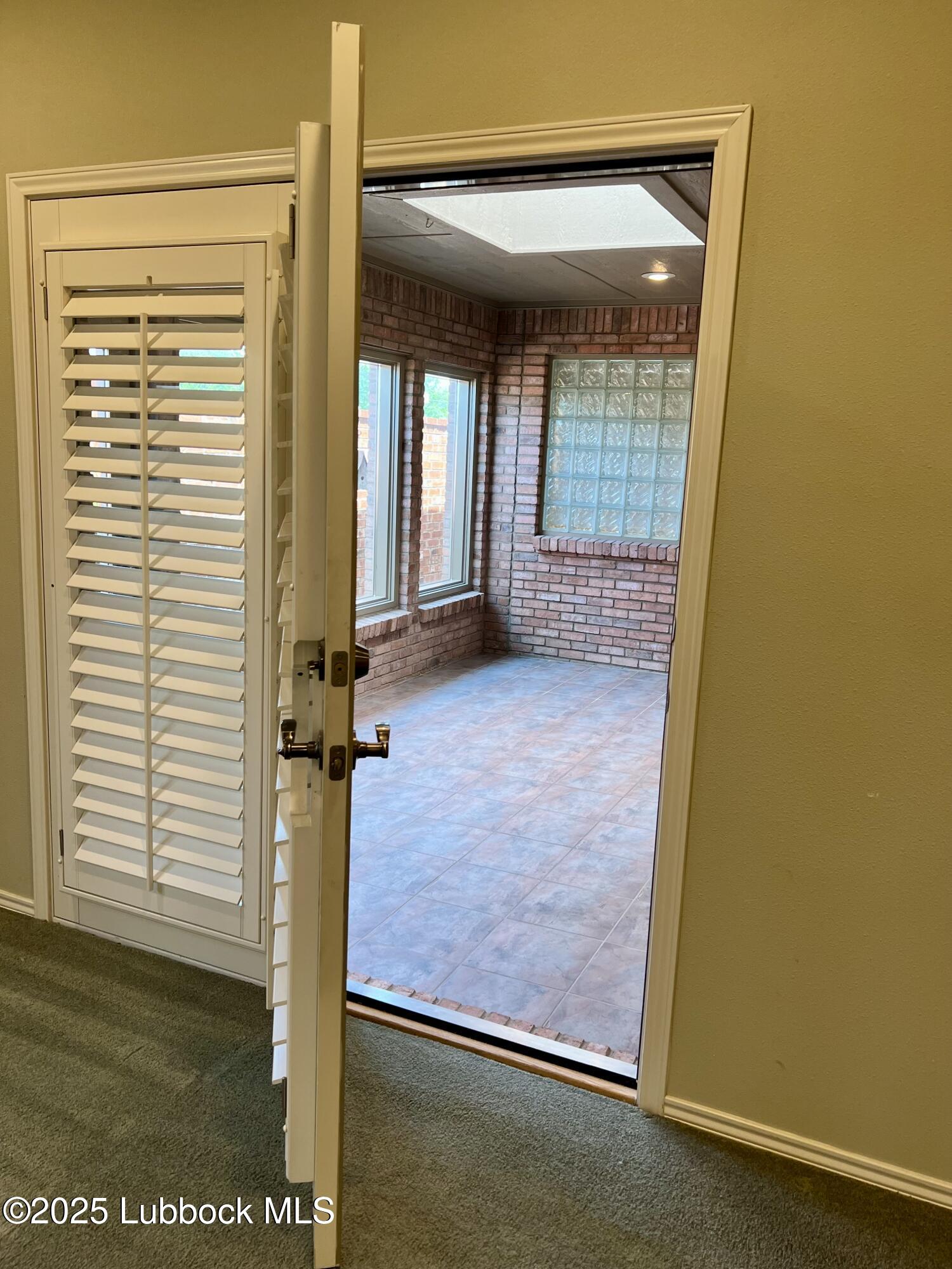 9802 Toledo Avenue Lubbock, TX 79424 - Photo 53 of 64 a view of an empty room with a window
