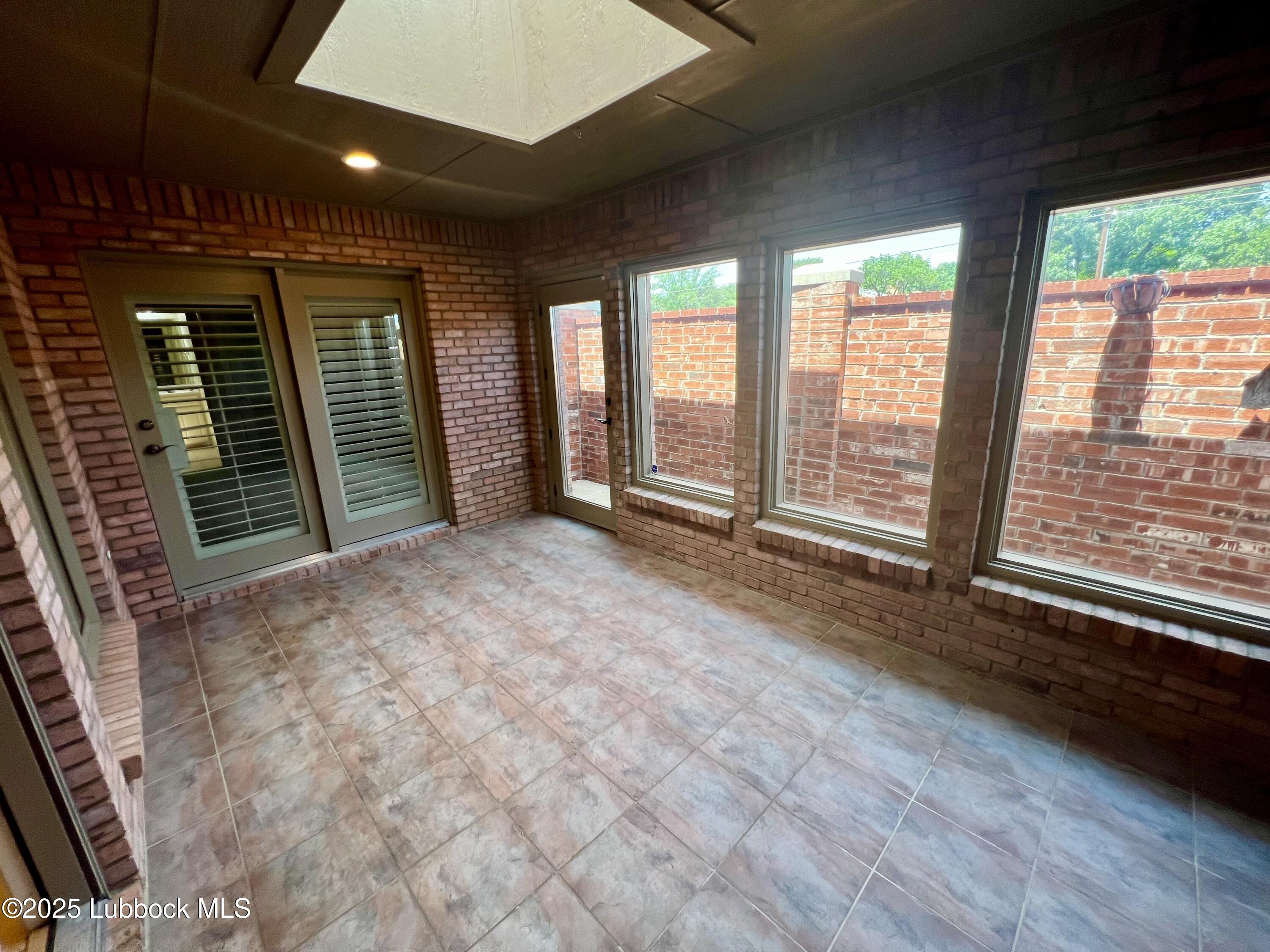 9802 Toledo Avenue Lubbock, TX 79424 - Photo 59 of 64 a view of an empty room with a balcony