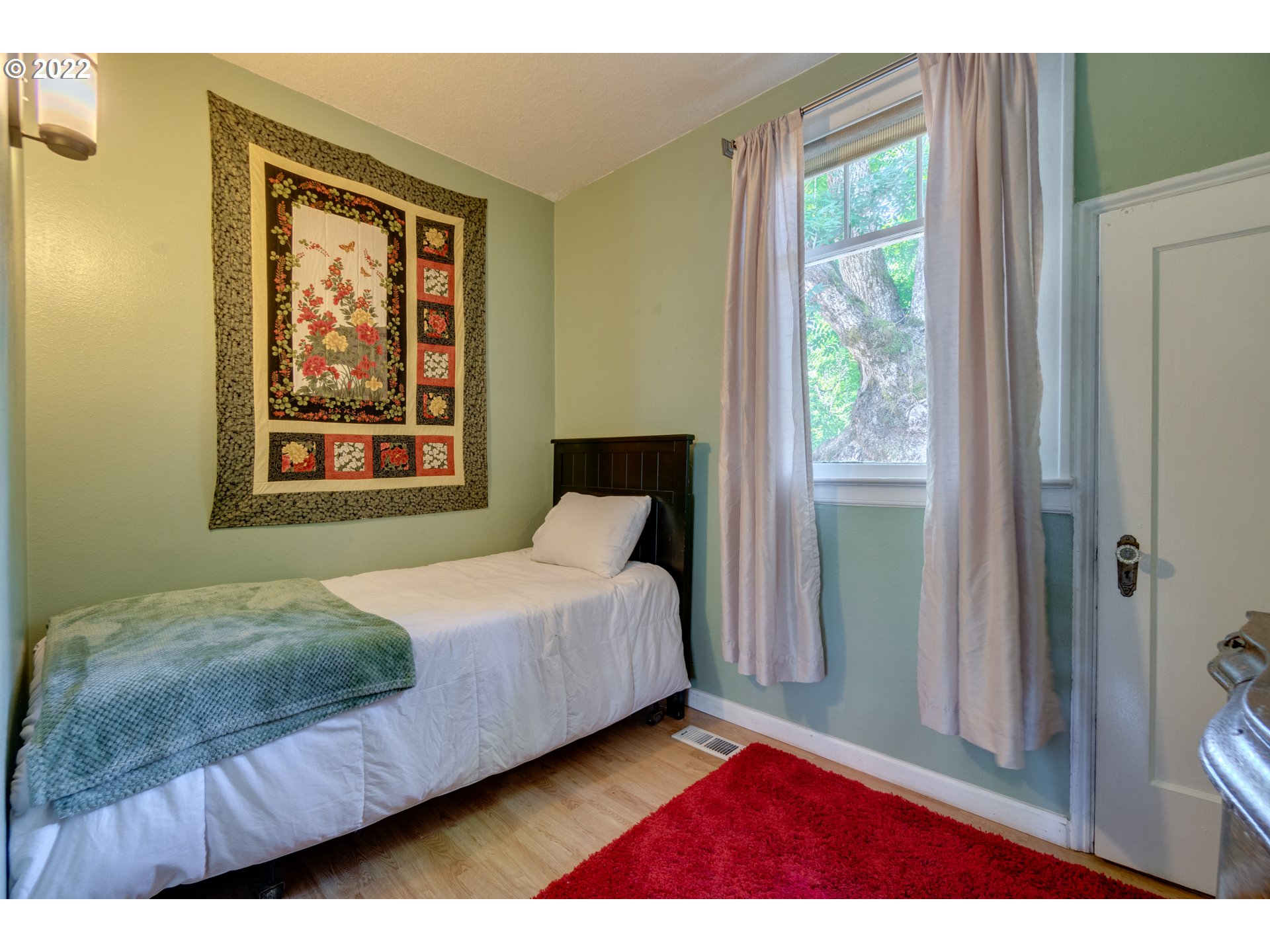 16636 Forsythe Road Oregon City, OR 97045 - Photo 11 of 29 a bedroom with a bed and a window