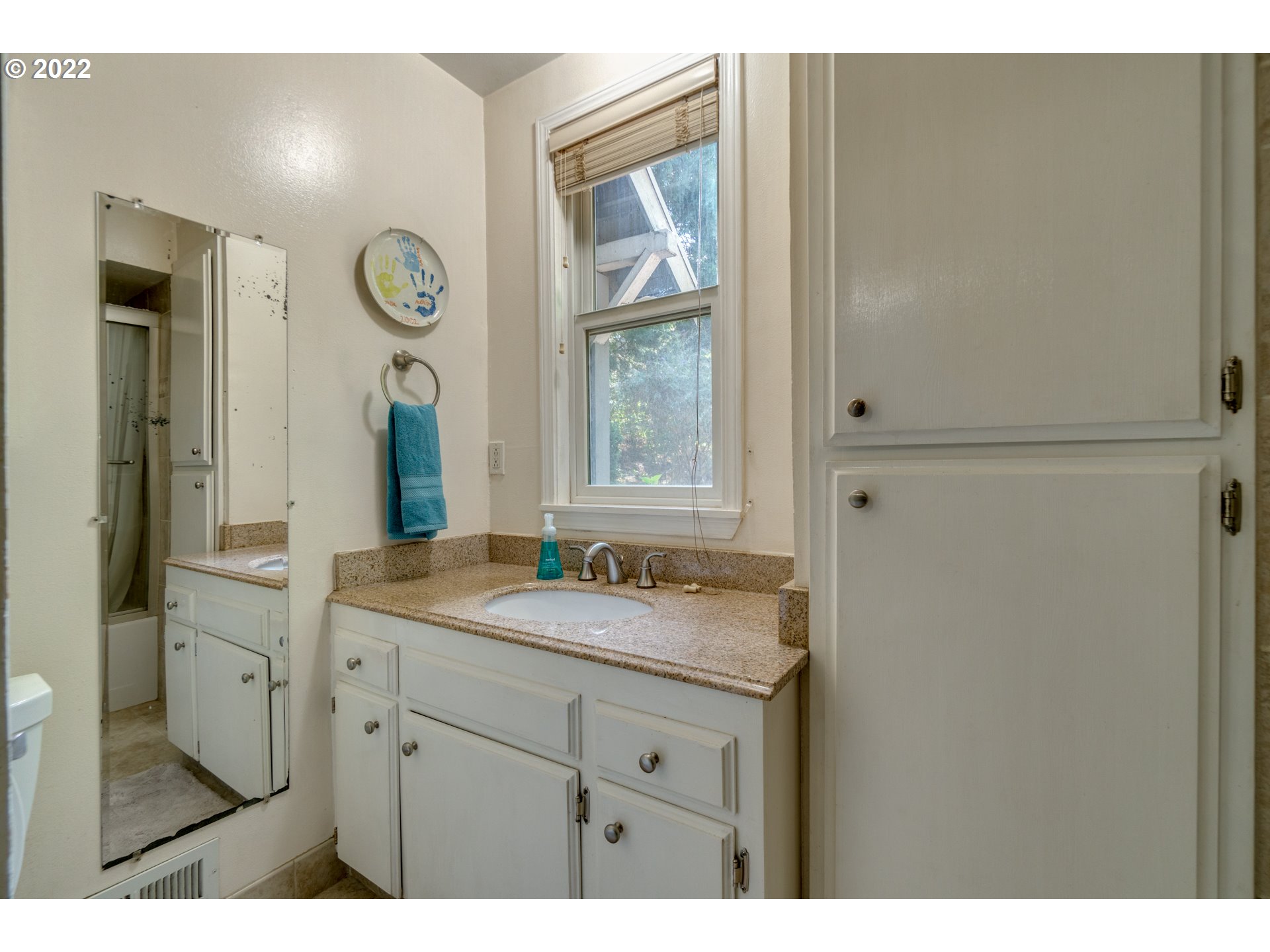 16636 Forsythe Road Oregon City, OR 97045 - Photo 13 of 29 a bathroom with a granite countertop sink and a mirror