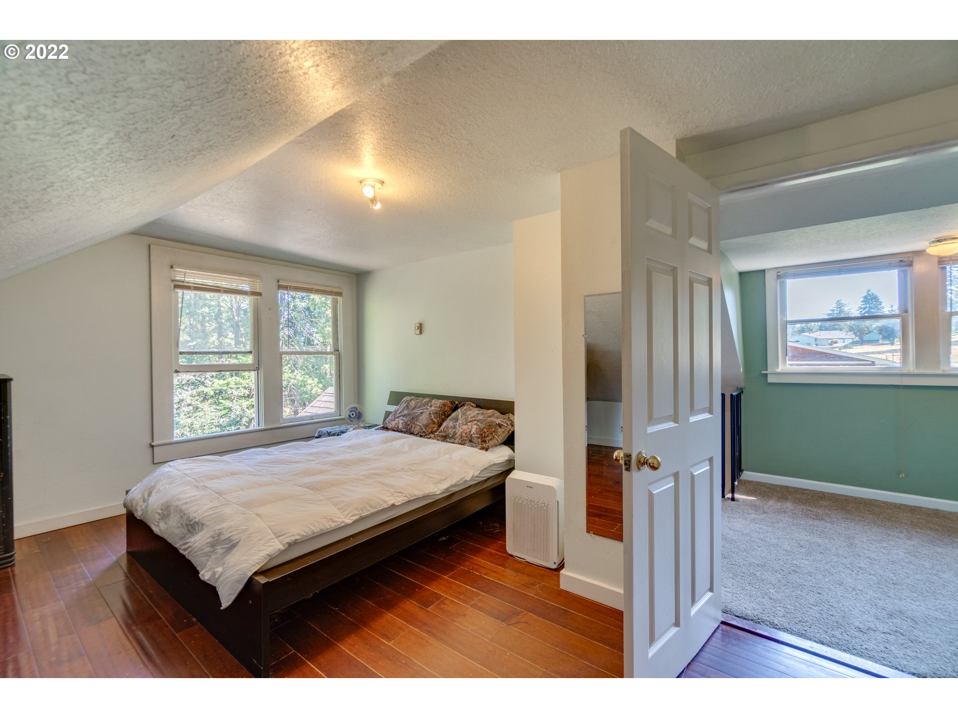 16636 Forsythe Road Oregon City, OR 97045 - Photo 16 of 29 a bedroom with a bed and a window