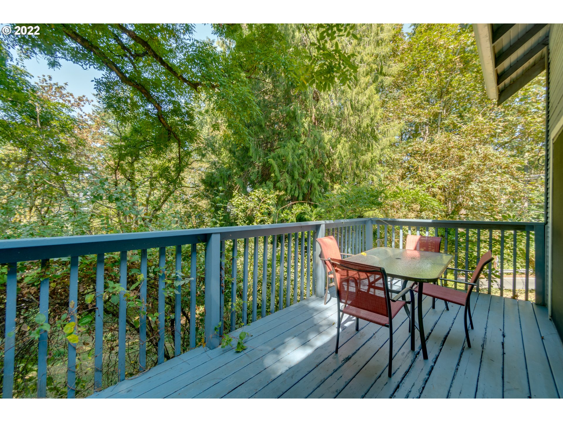 16636 Forsythe Road Oregon City, OR 97045 - Photo 18 of 29 a view of a balcony with wooden floor and outdoor seating