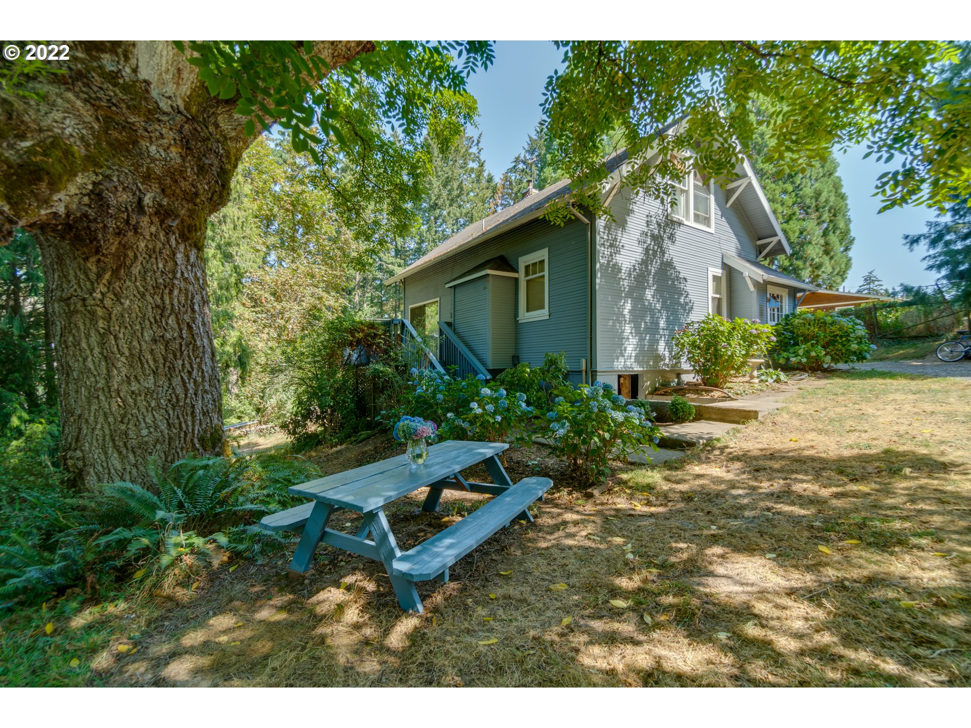 16636 Forsythe Road Oregon City, OR 97045 - Photo 19 of 29 a backyard of a house with wooden floor and outdoor seating