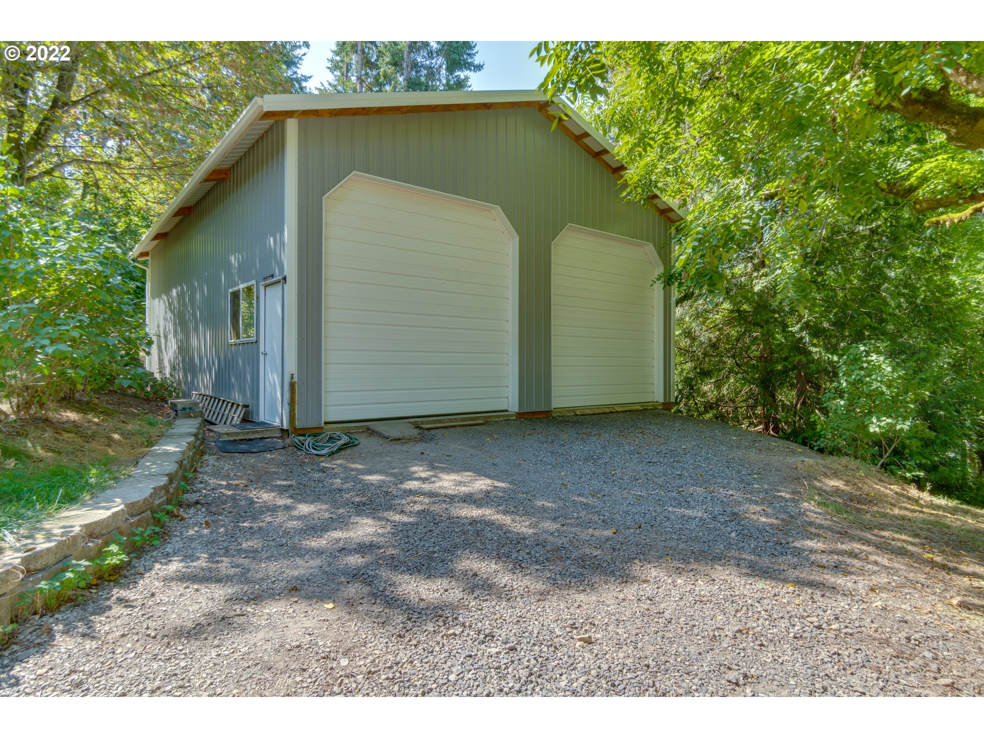 16636 Forsythe Road Oregon City, OR 97045 - Photo 22 of 29 a backyard of a house with a garage