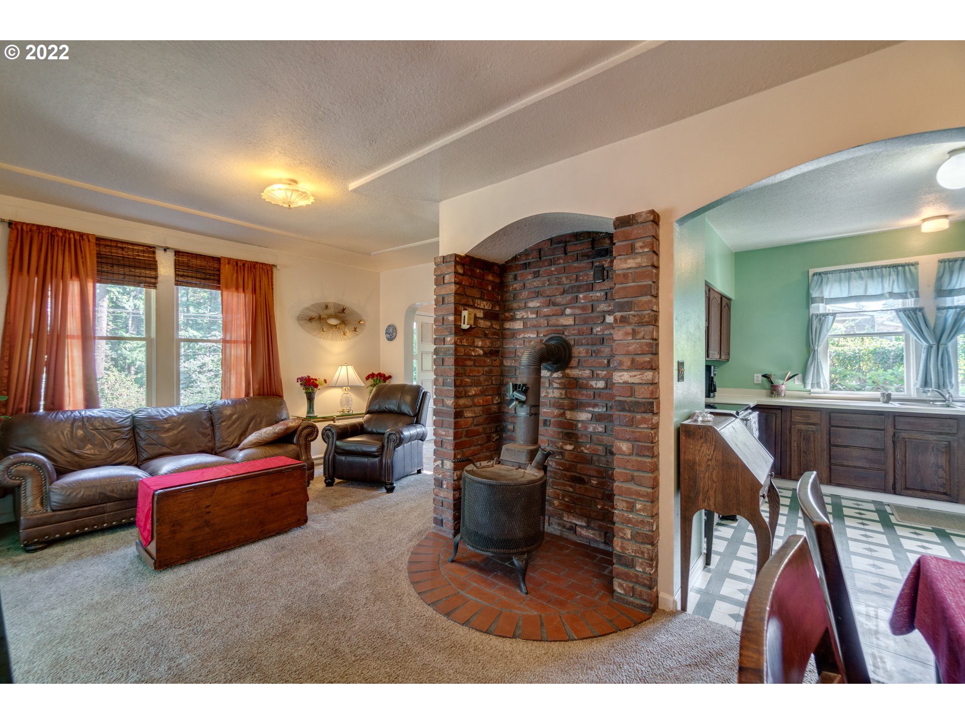16636 Forsythe Road Oregon City, OR 97045 - Photo 7 of 29 a living room with furniture a window and a fireplace