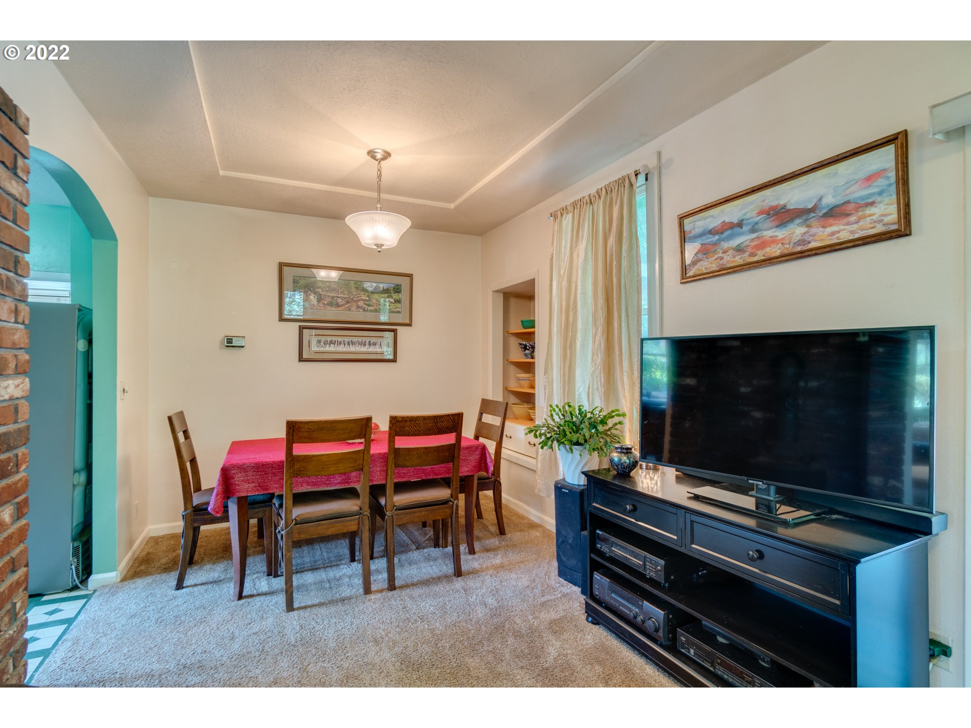 16636 Forsythe Road Oregon City, OR 97045 - Photo 8 of 29 a living room with furniture a flat screen tv and a fireplace