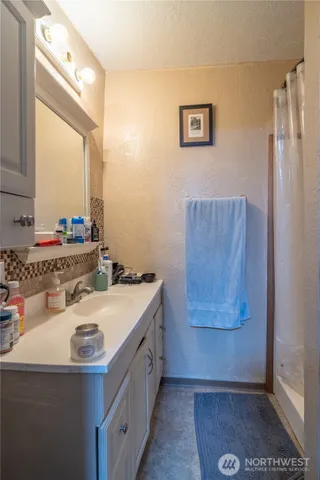 a bathroom with a sink and a mirror