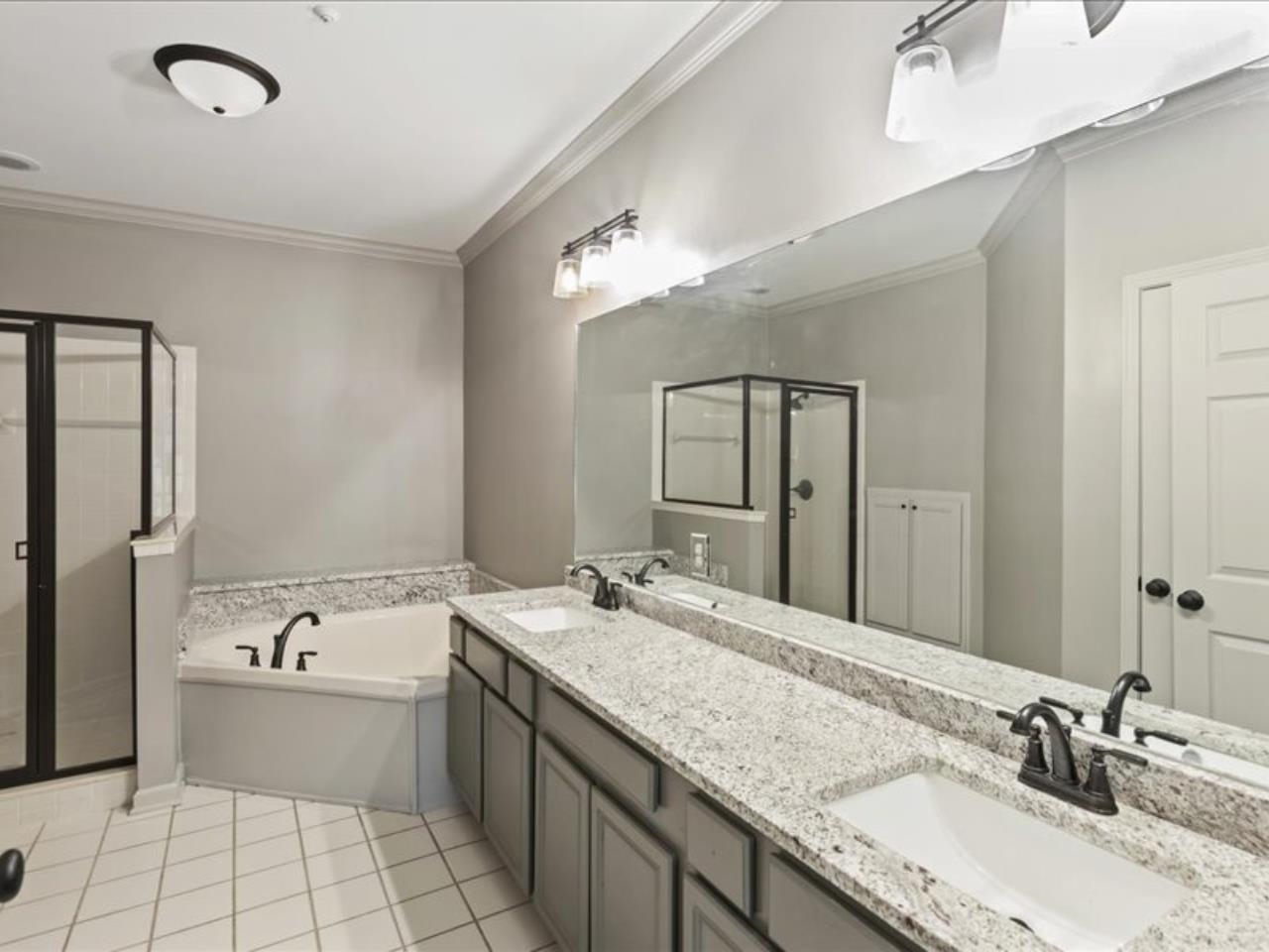 1672 Village Ridge Road, Unit 69 Collierville, TN 38017 - Photo 11 of 23 Full bath with crown molding, a garden tub, a sink, and a stall shower