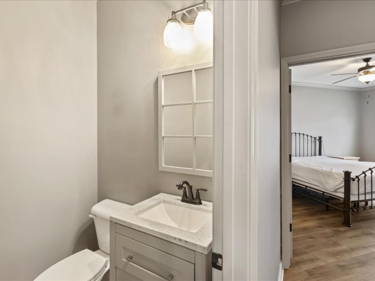 1672 Village Ridge Road, Unit 69 Collierville, TN 38017 - Photo 12 of 23 Half bathroom with vanity, toilet, ceiling fan, and wood finished floors