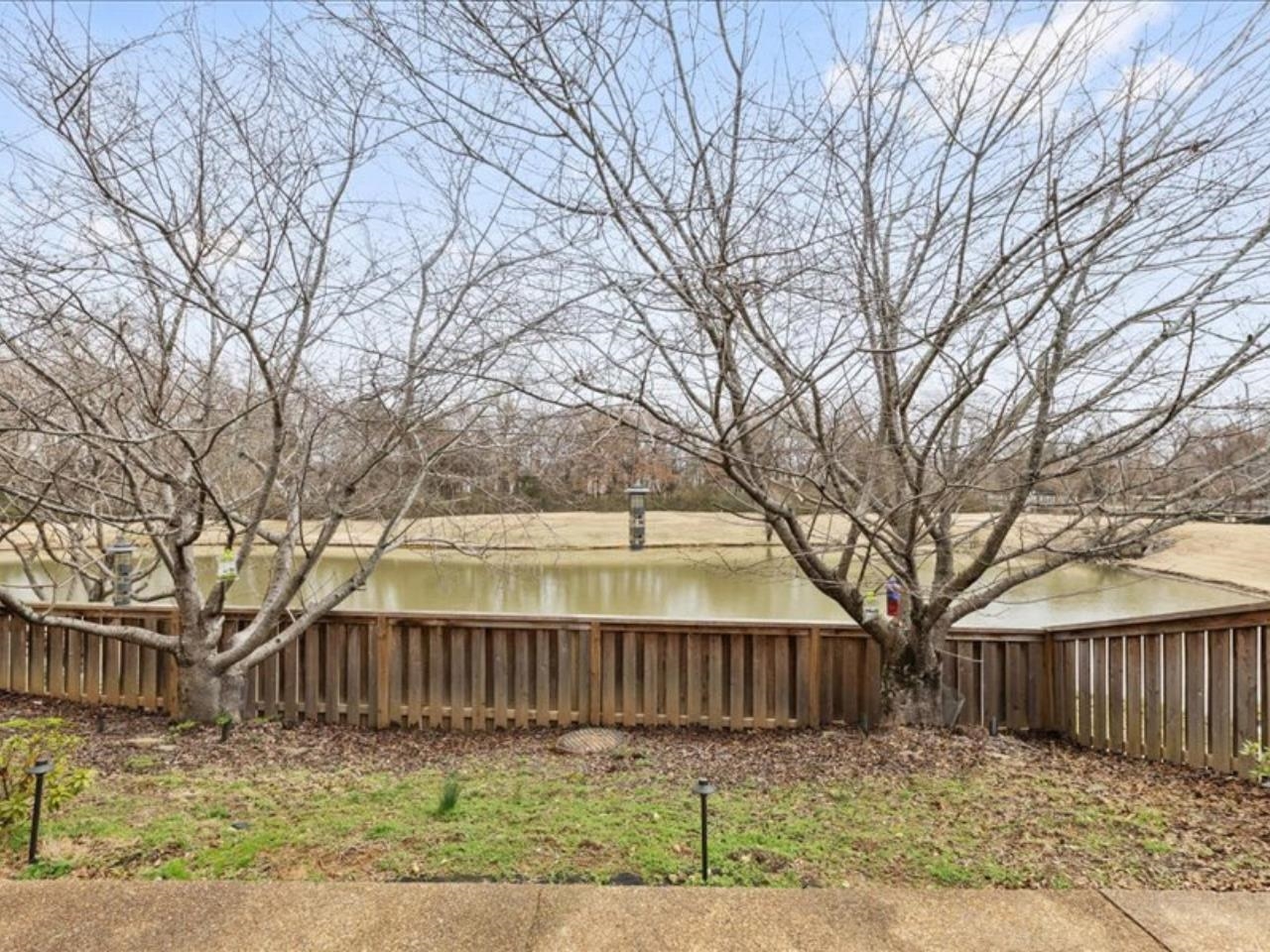 1672 Village Ridge Road, Unit 69 Collierville, TN 38017 - Photo 18 of 23 View of yard featuring a water view and fence