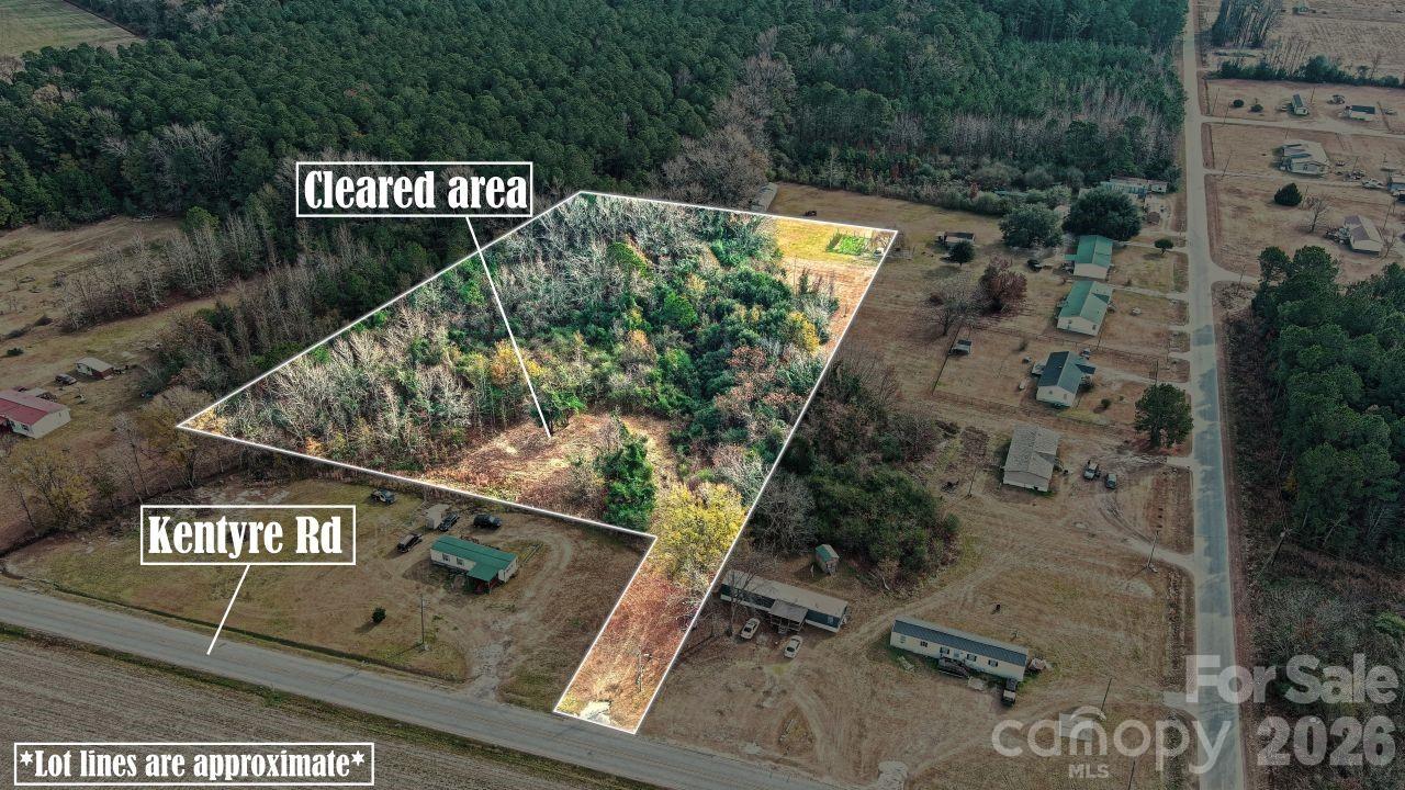 3608 Kentyre Road Hamer, SC 29547 - Photo 1 of 8 a street sign sitting on a wall next to a road