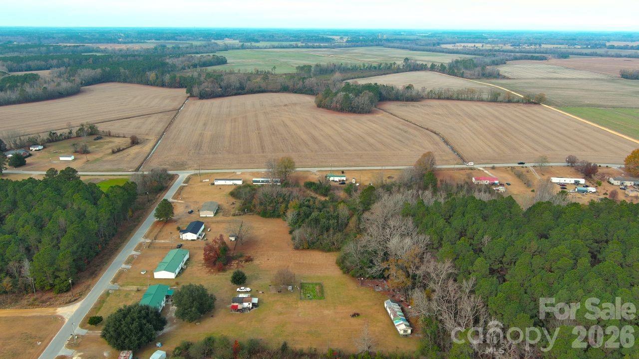 3608 Kentyre Road Hamer, SC 29547 - Photo 2 of 8 an aerial view of residential houses with outdoor space and trees