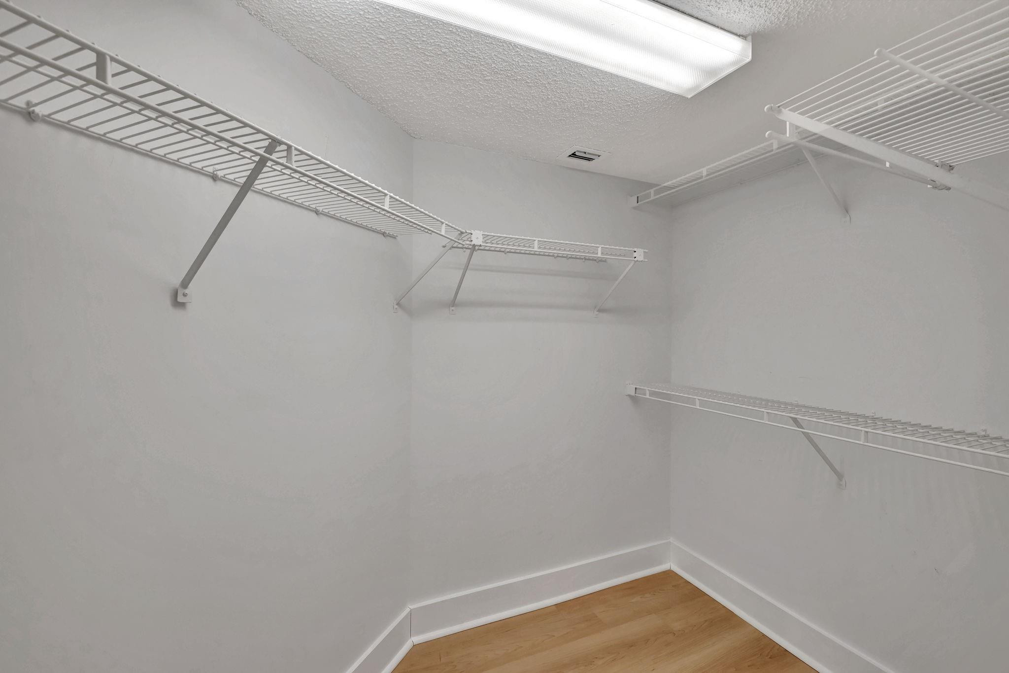 1801 Eleuthera Point, Unit E1 Coconut Creek, FL 33066 - Photo 24 of 50 a view of a room with racks on the wall