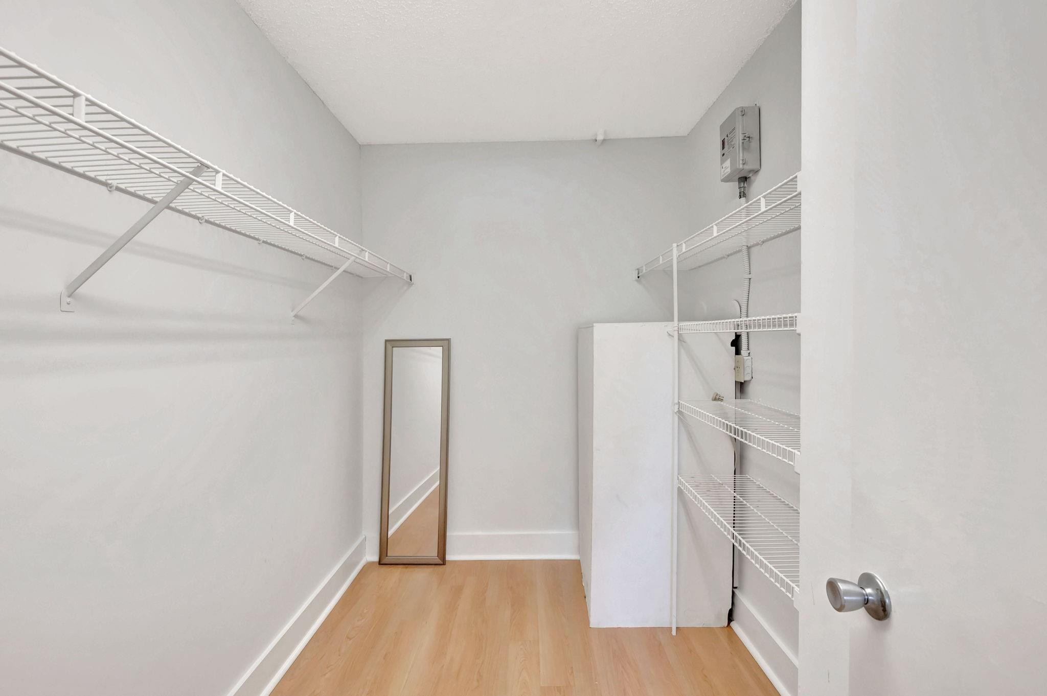 1801 Eleuthera Point, Unit E1 Coconut Creek, FL 33066 - Photo 27 of 50 a view of empty room with wooden floor