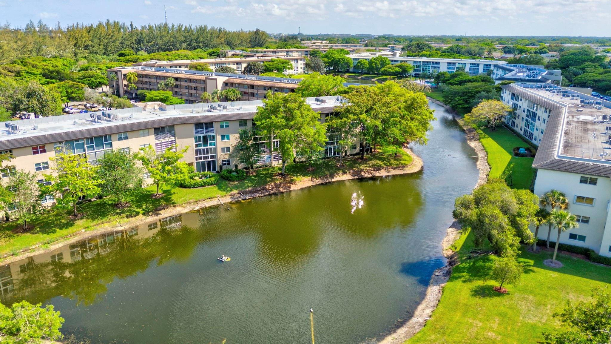 1801 Eleuthera Point, Unit E1 Coconut Creek, FL 33066 - Photo 35 of 50 an aerial view of residential houses with outdoor space and lake view