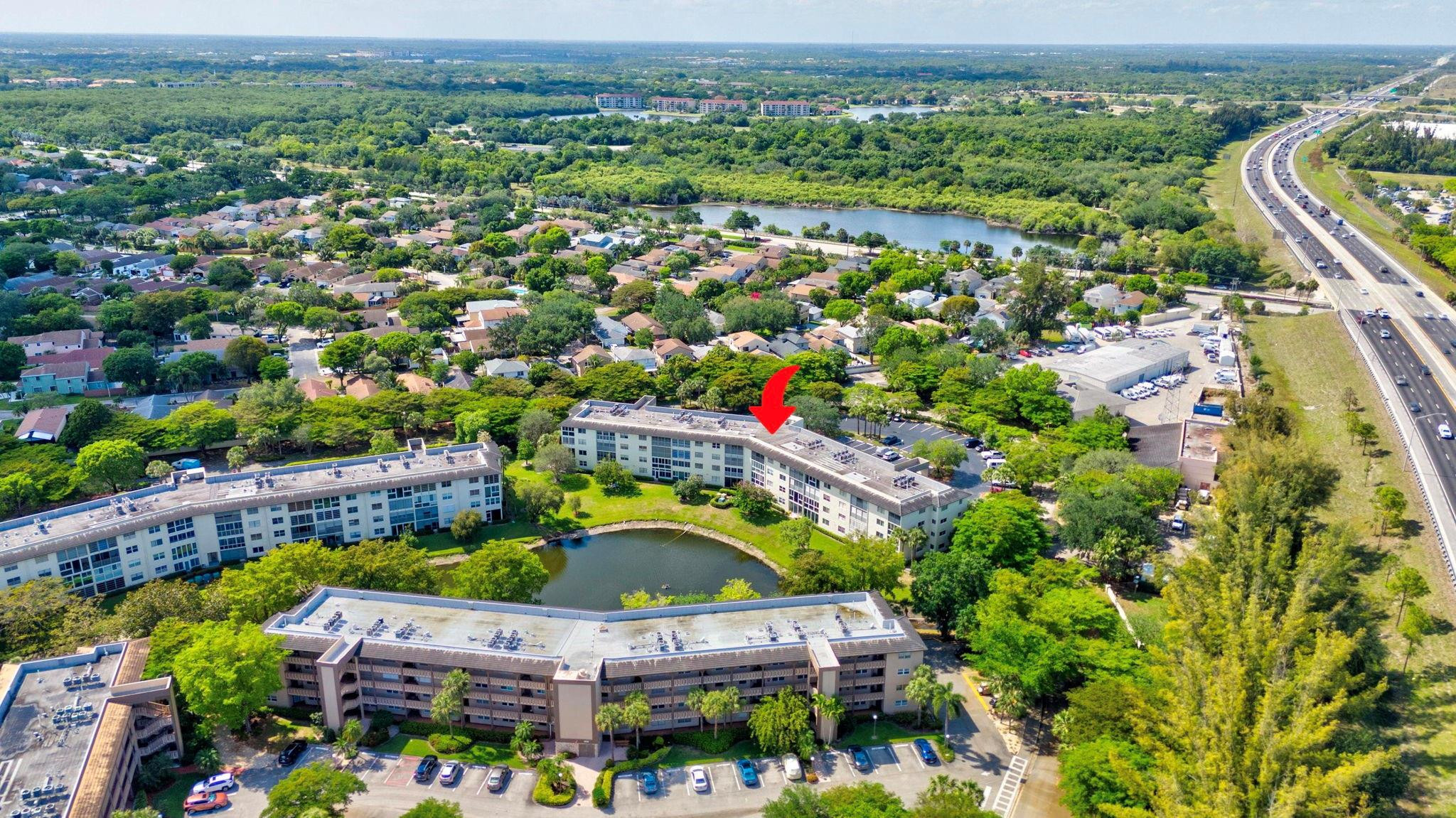 1801 Eleuthera Point, Unit E1 Coconut Creek, FL 33066 - Photo 37 of 50 an aerial view of a house with a garden