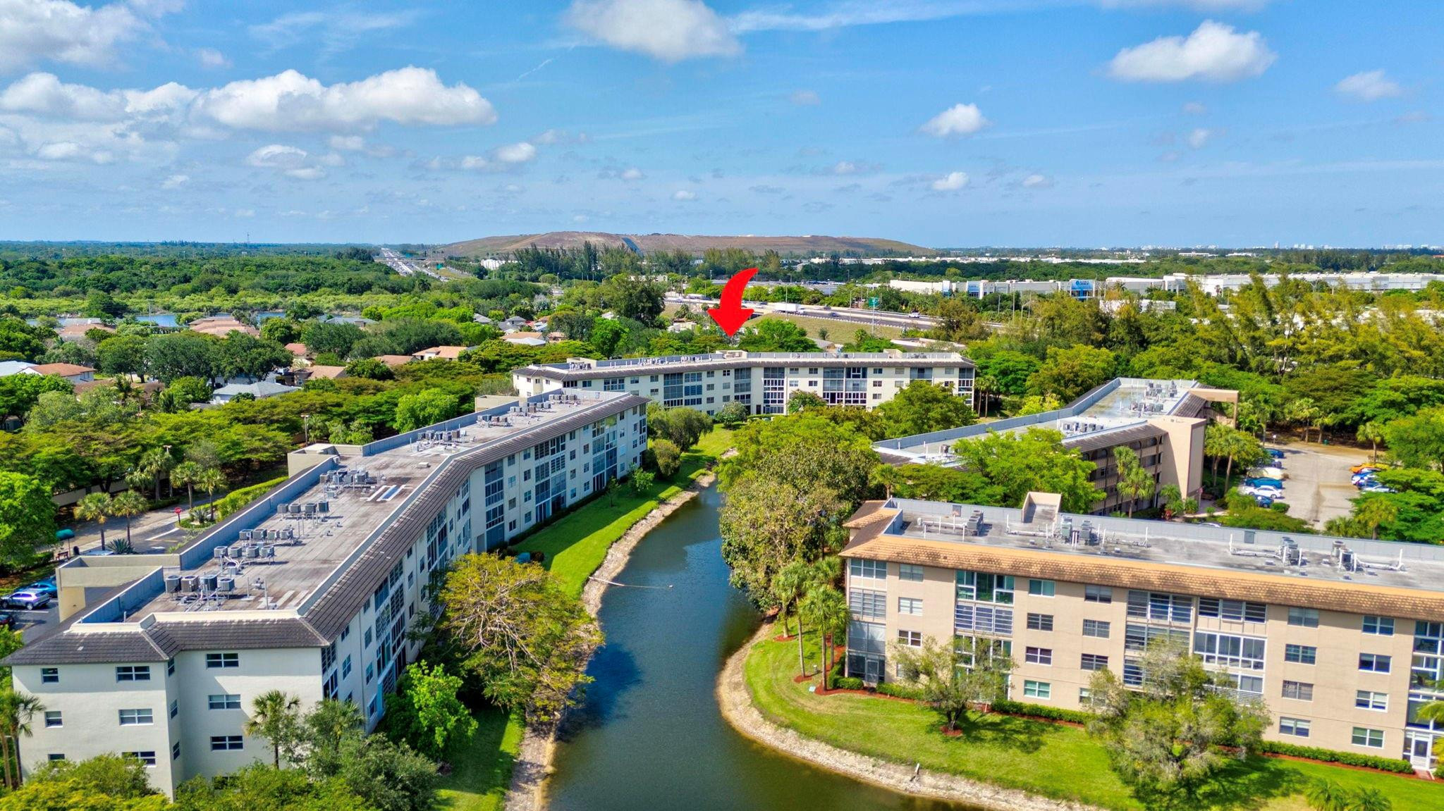 1801 Eleuthera Point, Unit E1 Coconut Creek, FL 33066 - Photo 41 of 50 a aerial view of a city